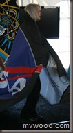 A picture of Beth Beck wrapped in a NASA banner like a cape.